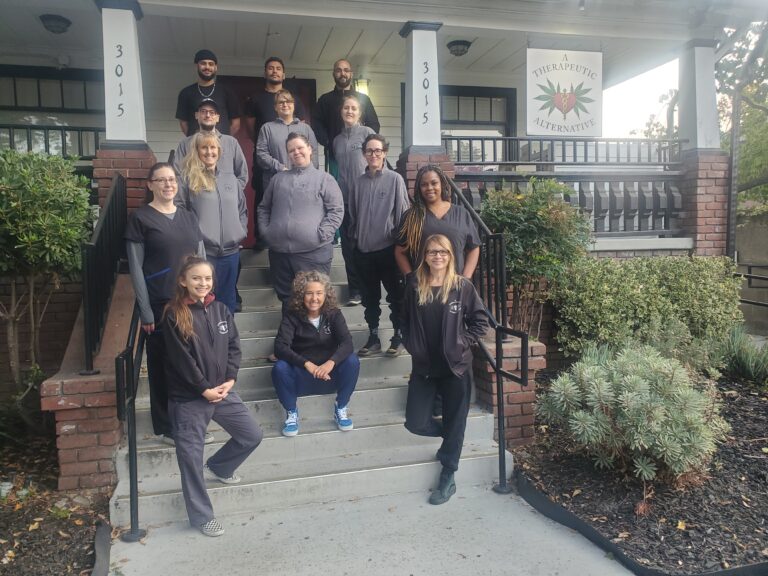 A Therapeutic Alterantive Staff Standing on Steps of A Therapeutic Altnernative